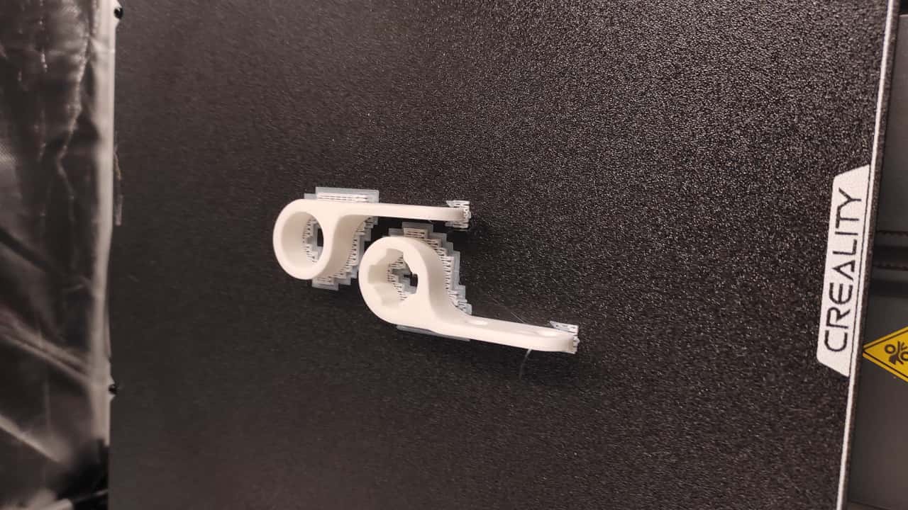 Raw 3D printed hinges on the print bed