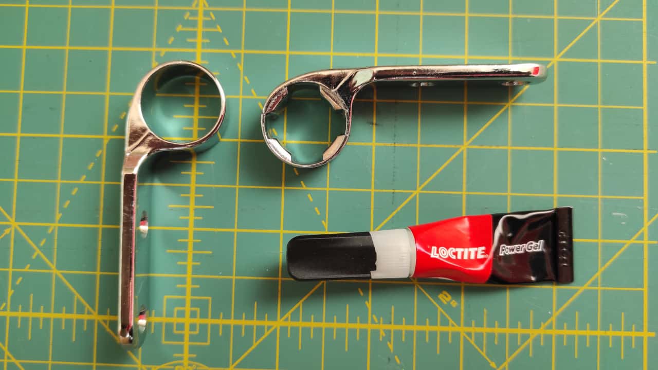 Broken original hinge temporarily fixed with superglue